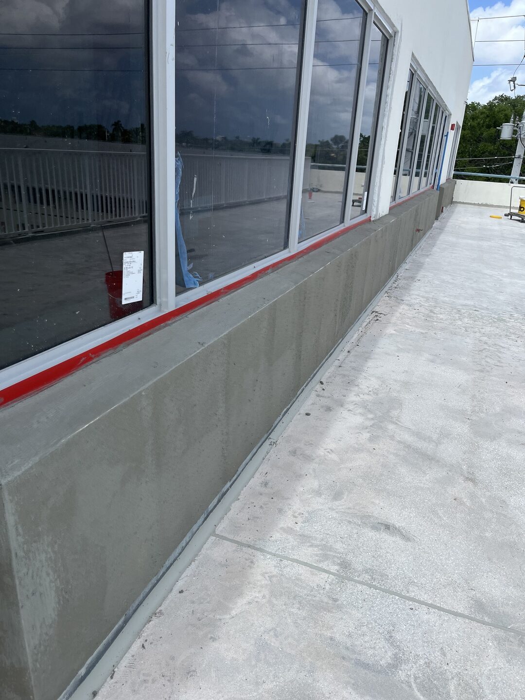 The same wall under the windows after the Sto waterproof coating, clean and watertight